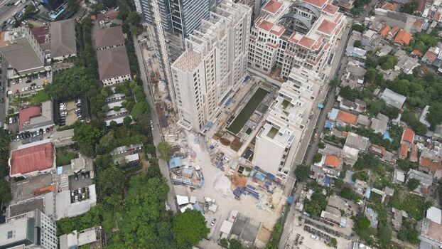 Aerial view of high rise buildings under construction in Jakarta Pusat surrounded by dense urban residential areas in Kecamatan Menteng Daerah Khusus Ibukota Indonesia. Aerial view of high rise buildings under construction in Jakarta Pusat surrounded by dense urban residential areas in Kecamatan Menteng Daerah Khusus Ibukota Indonesia.