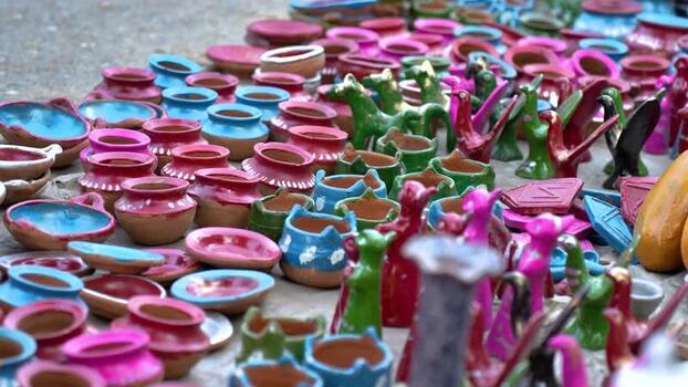 View of colorful handmade clay pottery and toys Bangladesh.