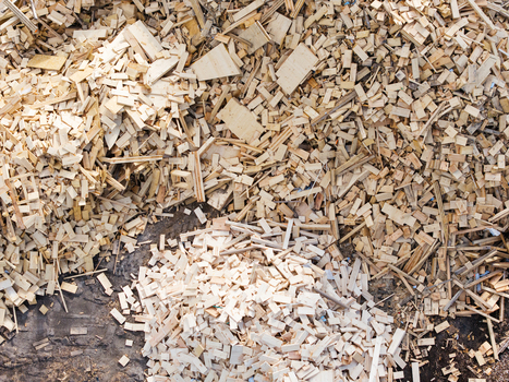 Aerial view of piles of wood chips and sawdust scattered on the ground at a lumber processing site in Salgale parish Jelgava Municipality Latvia. Aerial view of piles of wood chips and sawdust scattered on the ground at a lumber processing site in Salgale parish Jelgava Municipality Latvia.