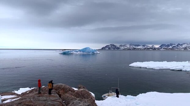 Aerial view of people watching icebergs in Tasiilaq Greenland. Aerial view of people watching icebergs in Tasiilaq Greenland.
