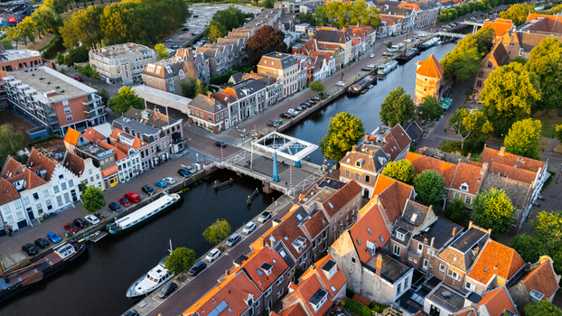 Aerial view of the historic city of Zwolle with its winding canals traditional Dutch architecture red tiled rooftops and the medieval Sassenpoort gatehouse in Zwolle Overijssel Netherlands.
