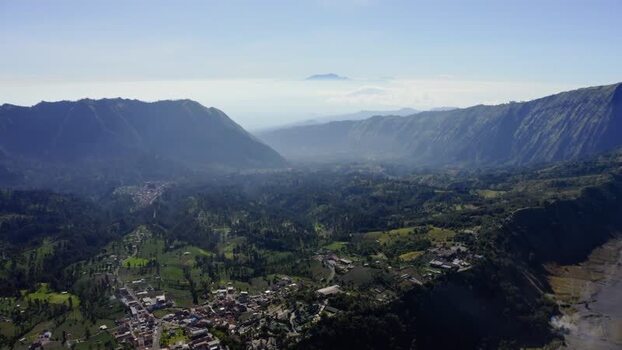 Aerial view of Mount Bromo and Tosari village on a mountain ridge Indonesia. Aerial view of Mount Bromo and Tosari village on a mountain ridge Indonesia.