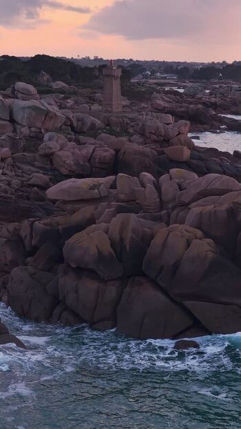 Aerial view of Phare de Men Ruz at sunset France.