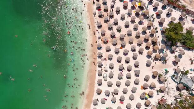 Aerial view of beach umbrellas and swimmers in Thasos Greece. Aerial view of beach umbrellas and swimmers in Thasos Greece.