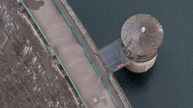 Aerial view of the Sengbachtalsperre dam featuring its stone wall water intake tower and reservoir in Solingen Nordrhein Westfalen Germany. Aerial view of the Sengbachtalsperre dam featuring its stone wall water intake tower and reservoir in Solingen Nordrhein Westfalen Germany.