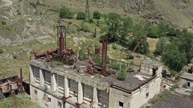 Aerial view of abandoned factory in Caucasus Mountains Russia.