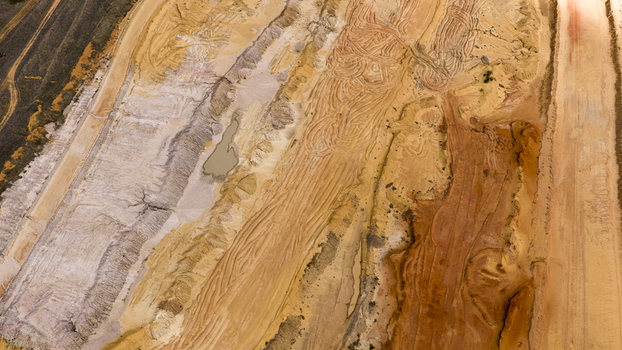 Aerial view of industrial salt production patterns in the sand with vibrant yellow orange and white textures in Kalbarri Western Australia Australia. Aerial view of industrial salt production patterns in the sand with vibrant yellow orange and white textures in Kalbarri Western Australia Australia.
