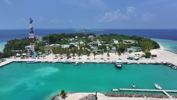 Aerial view of Kamadhoo island harbor and communication tower Maldives. Aerial view of Kamadhoo island harbor and communication tower Maldives.