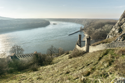 View of the historic Devin Castle ruins and stone watchtowers overlooking the Danube river bend and surrounding forests Bratislava IV Bratislava Region Slovakia. View of the historic Devin Castle ruins and stone watchtowers overlooking the Danube river bend and surrounding forests Bratislava IV Bratislava Region Slovakia.