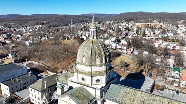 Aerial view of the Cathedral of the Blessed Sacrament with its prominent dome surrounded by residential neighborhoods and urban landscape in Altoona Pennsylvania United States.