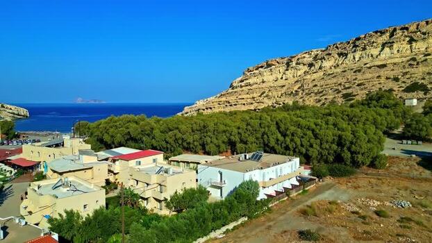 Aerial view of coastal buildings and cliffs in Crete Greece.
