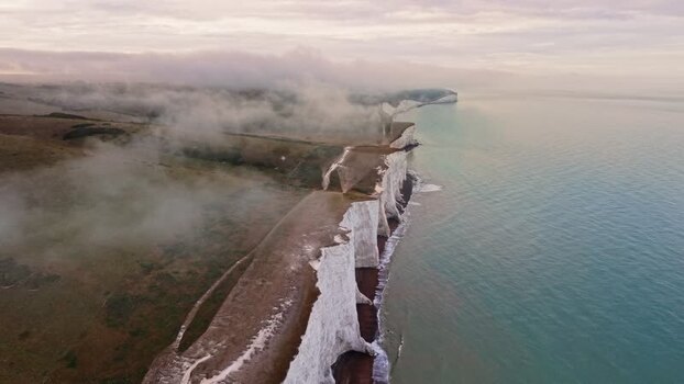 Aerial view of Seven Sisters Cliffs and mist United Kingdom. Aerial view of Seven Sisters Cliffs and mist United Kingdom.