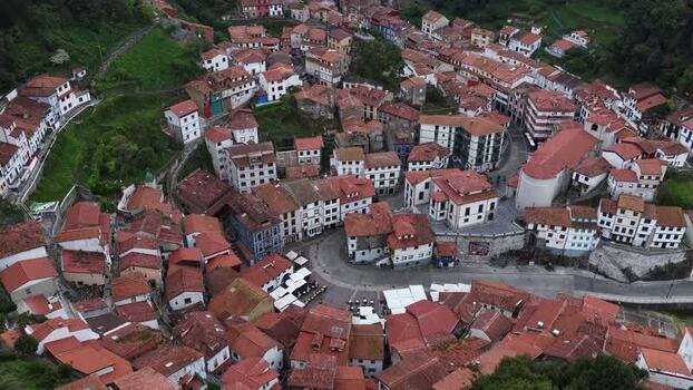 Aerial view of the colorful houses and red rooftops of Cudillero Spain. Aerial view of the colorful houses and red rooftops of Cudillero Spain.
