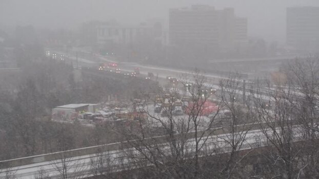 View of traffic on a highway during a heavy snowstorm United States. View of traffic on a highway during a heavy snowstorm United States.