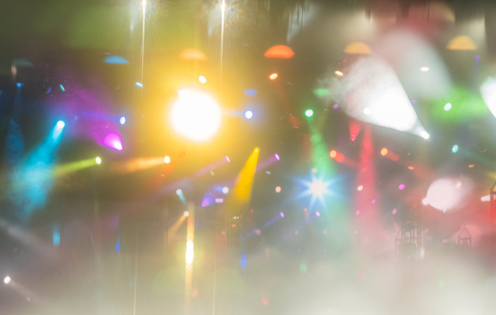 View of vibrant concert stage lighting with colorful beams and haze in Nyon Switzerland.