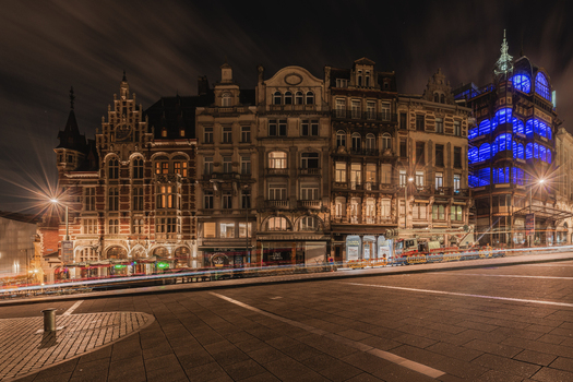 View of the historic Old England building illuminated at night with light trails on the street in Brussels Brussels Belgium.