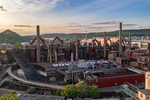 Volklingen Germany 09 May 2026 Aerial view of the Volklingen Ironworks with its massive blast furnaces and industrial chimneys under a soft evening sky in Saarland. Volklingen Germany 09 May 2026 Aerial view of the Volklingen Ironworks with its massive blast furnaces and industrial chimneys under a soft evening sky in Saarland.