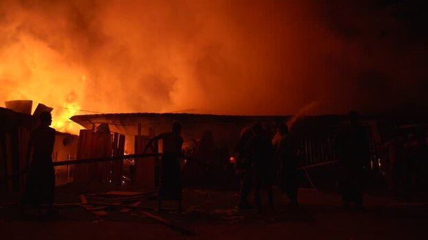 View of a massive fire at night in Khagrachari Bangladesh. View of a massive fire at night in Khagrachari Bangladesh.