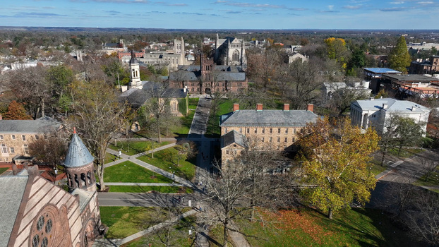 Aerial view of Princeton University campus featuring historic gothic architecture stone buildings lush green lawns and autumn trees in Princeton New Jersey United States.