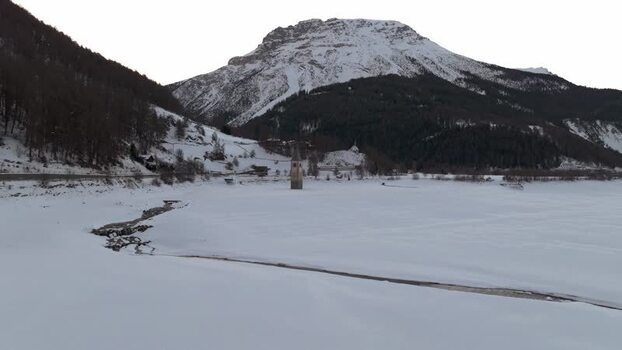 Aerial view of submerged church tower in Graun im Vinschgau Italy. Aerial view of submerged church tower in Graun im Vinschgau Italy.