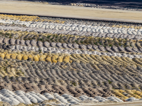 Aerial view of Tagebau Welzow Sud brown coal open pit mine showing rows of excavated earth and soil mounds in Spremberg Brandenburg Germany. Aerial view of Tagebau Welzow Sud brown coal open pit mine showing rows of excavated earth and soil mounds in Spremberg Brandenburg Germany.
