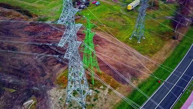 Aerial view of power transmission towers in Latvia.