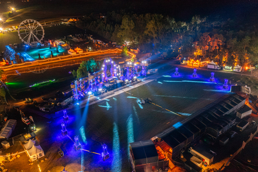 Herzogenaurach Germany 25 July 2025 Aerial view of the Open Beatz Festival at night featuring a large Ferris wheel illuminated stages and vibrant light displays. Herzogenaurach Germany 25 July 2025 Aerial view of the Open Beatz Festival at night featuring a large Ferris wheel illuminated stages and vibrant light displays.