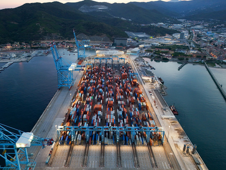 Aerial view of the Vado Ligure container terminal a semi automated port with rows of shipping containers large cranes and storage facilities in Vado Ligure Liguria Italy. Aerial view of the Vado Ligure container terminal a semi automated port with rows of shipping containers large cranes and storage facilities in Vado Ligure Liguria Italy.