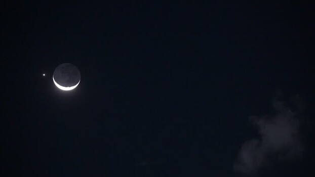 View of the crescent moon in the night sky Brazil.