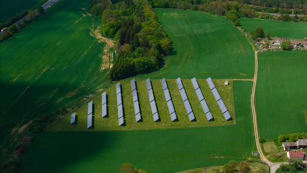 Aerial view of solar panels in a green field near Zipotin surrounded by lush forests and agricultural land in Gruna Pardubicky kraj Czechia. Aerial view of solar panels in a green field near Zipotin surrounded by lush forests and agricultural land in Gruna Pardubicky kraj Czechia.