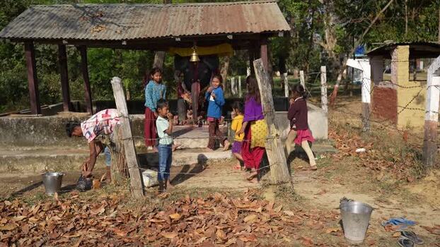 View of children near a small temple in Dhangadhi Nepal. View of children near a small temple in Dhangadhi Nepal.