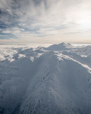 Aerial view of the snow covered Gaustablikk Fjellresort area with rugged mountain peaks and vast winter landscape in Rjukan Telemark Norway. Aerial view of the snow covered Gaustablikk Fjellresort area with rugged mountain peaks and vast winter landscape in Rjukan Telemark Norway.