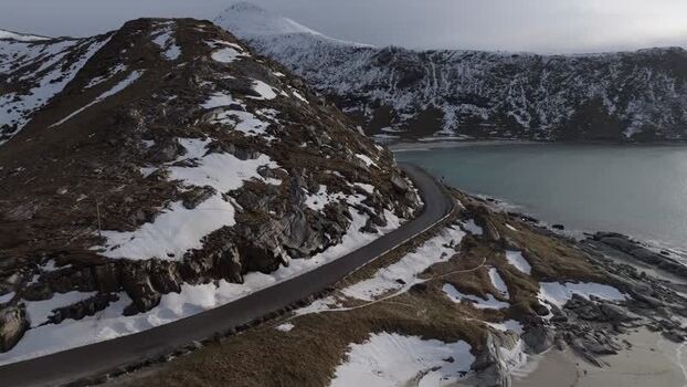 Aerial view of Lofoten coastal road by the sea Norway.