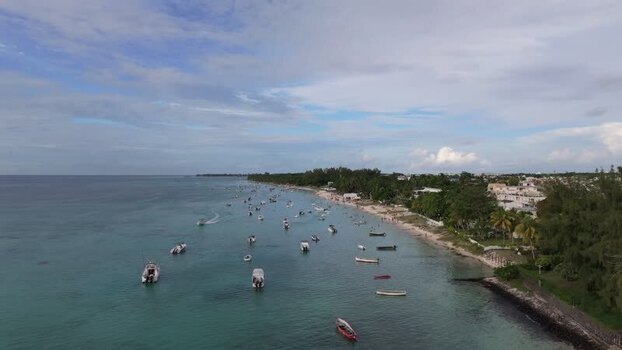Aerial view of Trou aux Biches Beach with boats Mauritius.