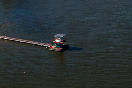 Aerial view of the Berlin Grunau Regatta Course featuring a small judge s tower on a platform connected by a long pier in the river in Berlin Berlin Germany. Aerial view of the Berlin Grunau Regatta Course featuring a small judge s tower on a platform connected by a long pier in the river in Berlin Berlin Germany.