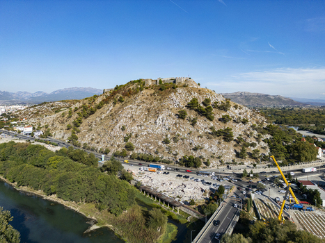 Aerial view of Rozafa Castle perched on a rocky hill overlooking the river and surrounding landscape in Shkoder Shkoder County Albania. Aerial view of Rozafa Castle perched on a rocky hill overlooking the river and surrounding landscape in Shkoder Shkoder County Albania.