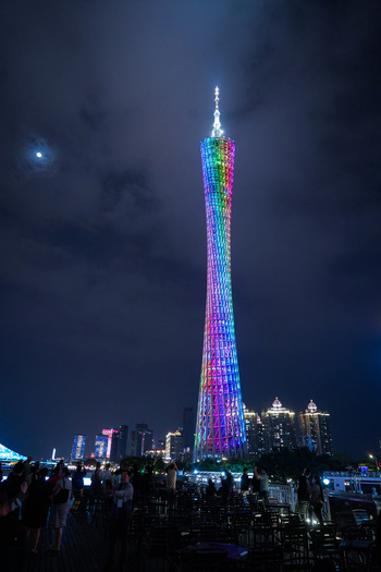 Guangzhou Guangdong Province China 22 February 2024 View of the illuminated Canton Tower at night with a crowd of people on a viewing deck. Guangzhou Guangdong Province China 22 February 2024 View of the illuminated Canton Tower at night with a crowd of people on a viewing deck.