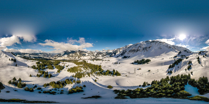 Aerial view of the snow covered mountains and pine forests of UNESCO Biosphare Entlebuch under a bright sun in Soerenberg Luzern Switzerland. Aerial view of the snow covered mountains and pine forests of UNESCO Biosphare Entlebuch under a bright sun in Soerenberg Luzern Switzerland.