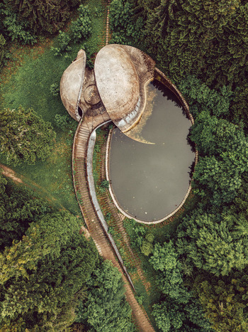 Aerial view of the Korcanica Memorial Zone with concrete structures and a pool in a forest on Grmec Mountain Sanski Most Federation of Bosnia Bosnia and Herzegovina. Aerial view of the Korcanica Memorial Zone with concrete structures and a pool in a forest on Grmec Mountain Sanski Most Federation of Bosnia Bosnia and Herzegovina.