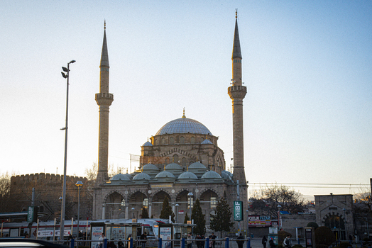 View of the historic Burunguz Mosque with its two tall minarets and central dome under a clear blue sky in Kayseri Kayseri Turkiye. View of the historic Burunguz Mosque with its two tall minarets and central dome under a clear blue sky in Kayseri Kayseri Turkiye.