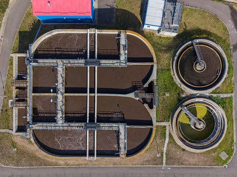 Aerial view of a sewage treatment plant featuring large aeration tanks and circular clarifiers in Targu Secuiesc Covasna County Romania.