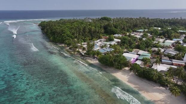 Aerial view of Maalhos island with lush palm trees and beaches Maldives. Aerial view of Maalhos island with lush palm trees and beaches Maldives.