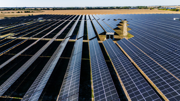 Aerial view of a large solar farm with rows of photovoltaic panels installed in a rural field in Temerin Vojvodina Serbia. Aerial view of a large solar farm with rows of photovoltaic panels installed in a rural field in Temerin Vojvodina Serbia.