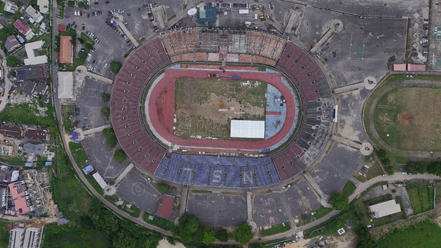 Aerial view of the National Stadium Surulere Lagos featuring its circular structure running track and surrounding urban landscape in Lagos Lagos Nigeria. Aerial view of the National Stadium Surulere Lagos featuring its circular structure running track and surrounding urban landscape in Lagos Lagos Nigeria.