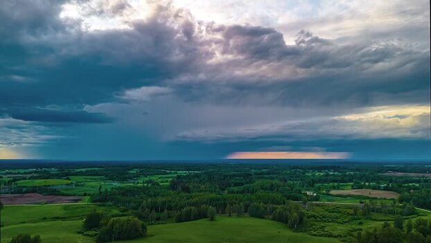 Aerial view of green landscape under stormy sky in Latvia. Aerial view of green landscape under stormy sky in Latvia.