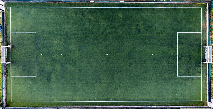 Aerial view of the soccer field at Brzece Sports Center featuring artificial turf and white markings in Brzece Rasina District Serbia.