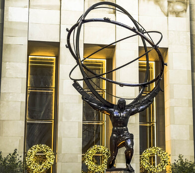 New York United States 26 September 2026 View of the iconic Atlas bronze statue at Rockefeller Center in Manhattan set against the building facade with decorative wreaths.