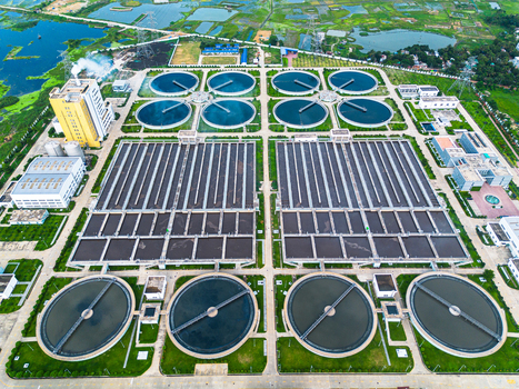 Aerial view of Sewage Treatment Plant Dhaka WASA featuring circular clarifiers rectangular filtration tanks and industrial infrastructure in Dhaka Dhaka Division Bangladesh. Aerial view of Sewage Treatment Plant Dhaka WASA featuring circular clarifiers rectangular filtration tanks and industrial infrastructure in Dhaka Dhaka Division Bangladesh.