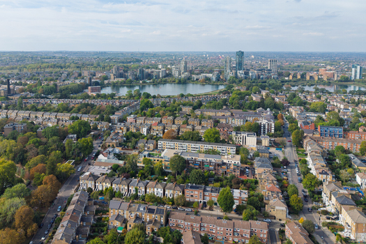 Aerial view of Stoke Newington featuring residential streets terraced houses and the West Reservoir surrounded by greenery in London England United Kingdom. Aerial view of Stoke Newington featuring residential streets terraced houses and the West Reservoir surrounded by greenery in London England United Kingdom.
