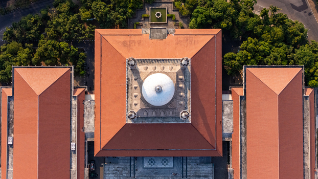 Aerial view of Masjid Agung Jawa Tengah featuring its prominent white dome terracotta tiled roofs and surrounding lush greenery in Kecamatan Gayamsari Jawa Tengah Indonesia. Aerial view of Masjid Agung Jawa Tengah featuring its prominent white dome terracotta tiled roofs and surrounding lush greenery in Kecamatan Gayamsari Jawa Tengah Indonesia.